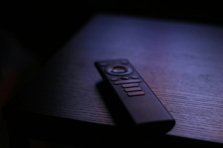 Television remote resting on a table