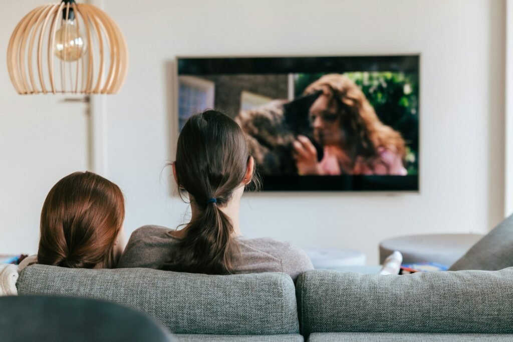 People watching television together at home