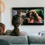 People watching television together at home