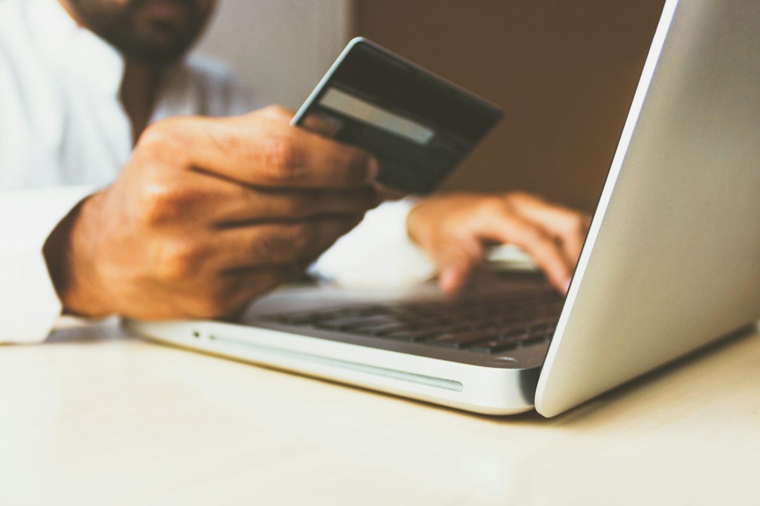 Card payment beside a laptop