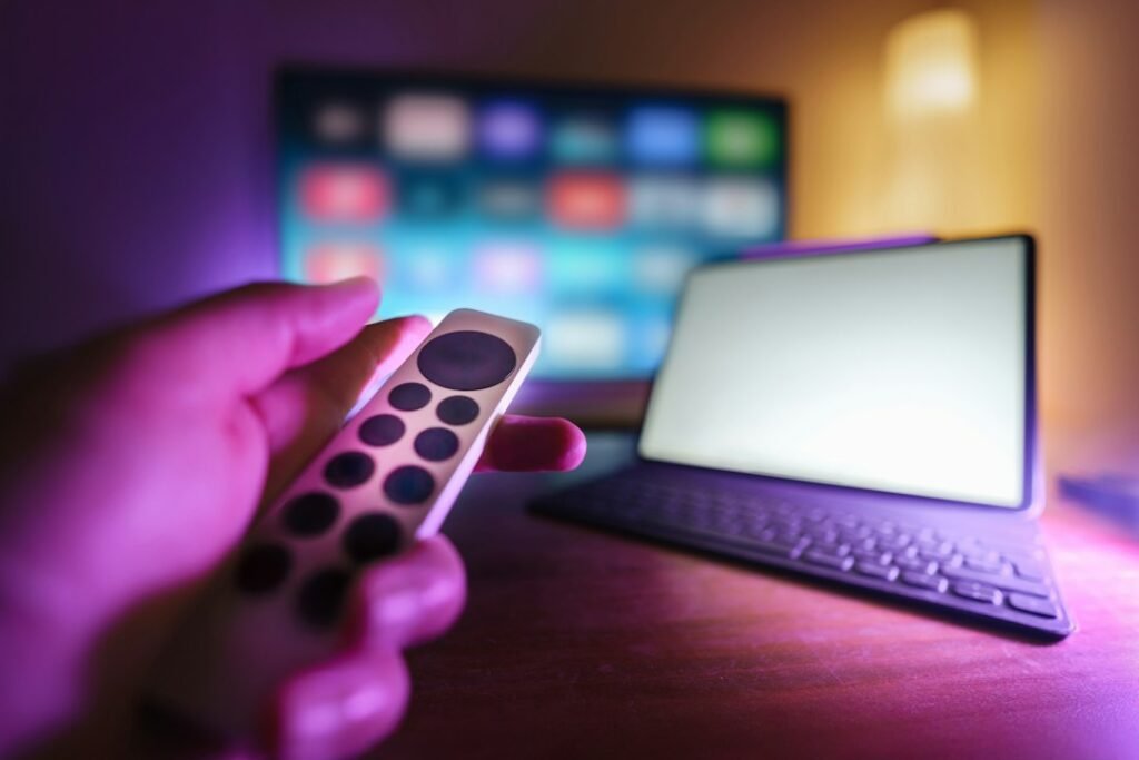Television and laptop in a home entertainment setup