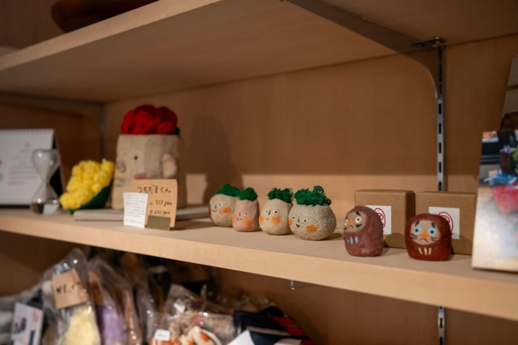 Small collectible figurines arranged on a shop display shelf