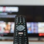 Television remote control with a Netflix button for a subscription plan guide