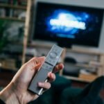 Smart television in a living room illustrating repeated streaming app login prompts
