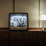 An illuminated television in a room, an illustrative photograph rather than Celebrity Jeopardy footage